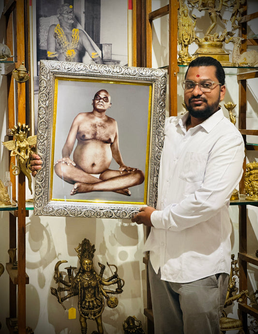 Silver-Framed Bhagwan Nityanand with Intricate Floral Design