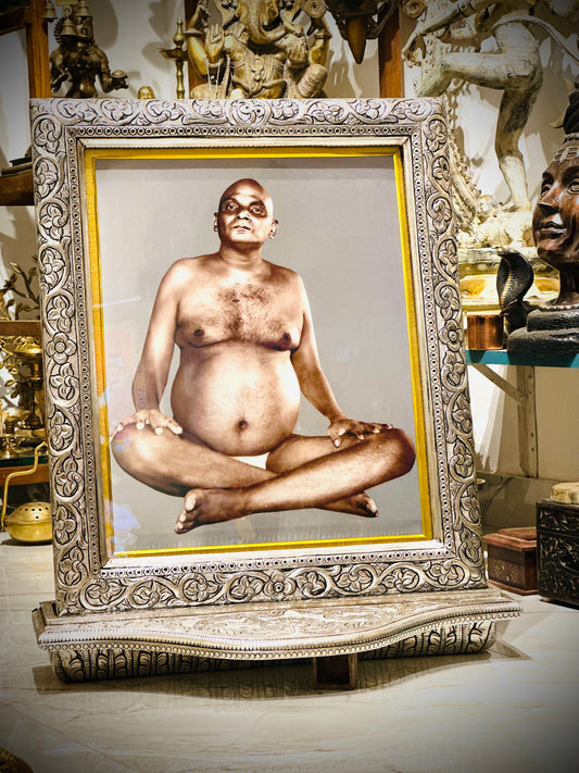 Silver-Framed Bhagwan Nityanand with Intricate Floral Design